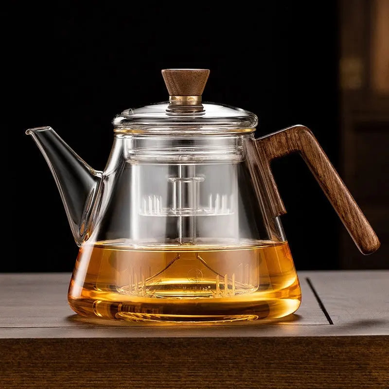 Close-up of borosilicate glass teapot with wooden handle