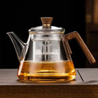 Close-up of borosilicate glass teapot with wooden handle